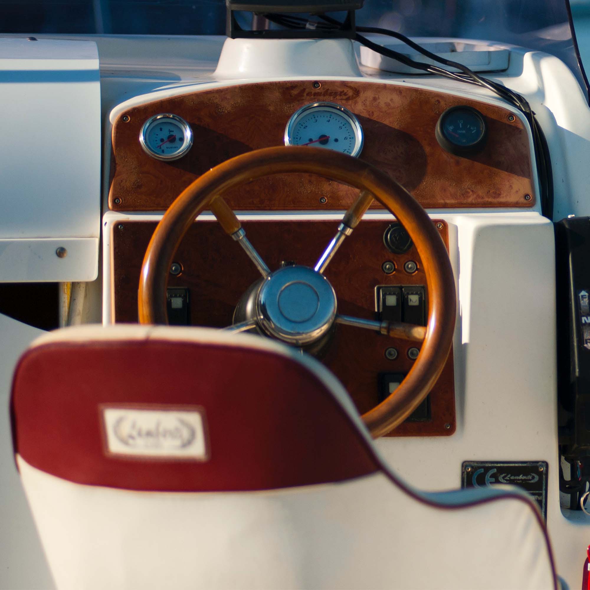 shot of a mahogany boat steering wheel